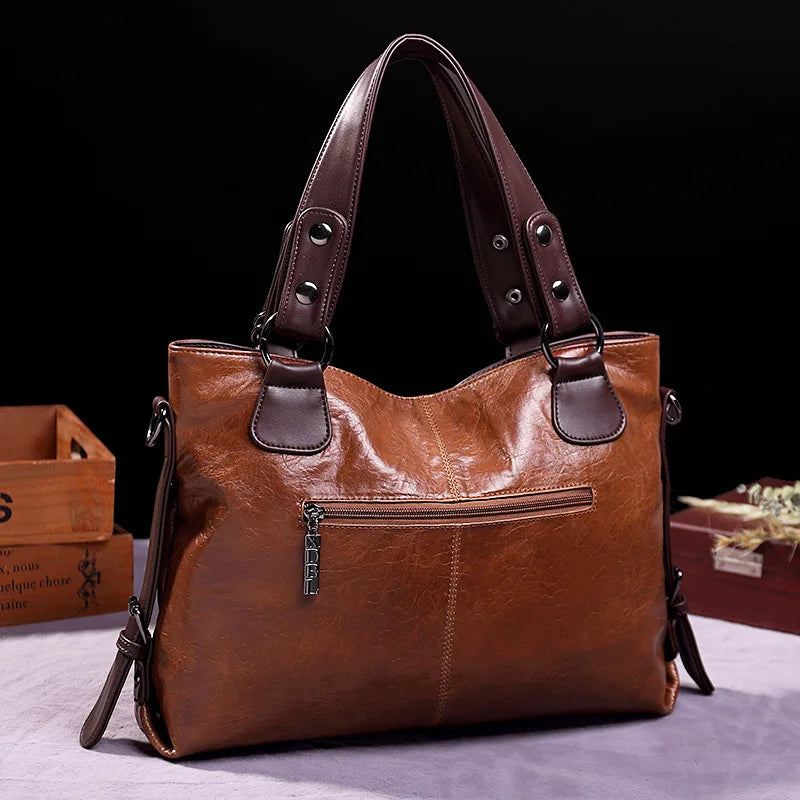 Botha™ Avery - Soft leather bag with two handles and elegant details