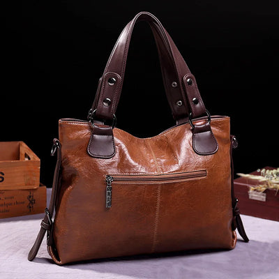 Botha™ Avery - Soft leather bag with two handles and elegant details