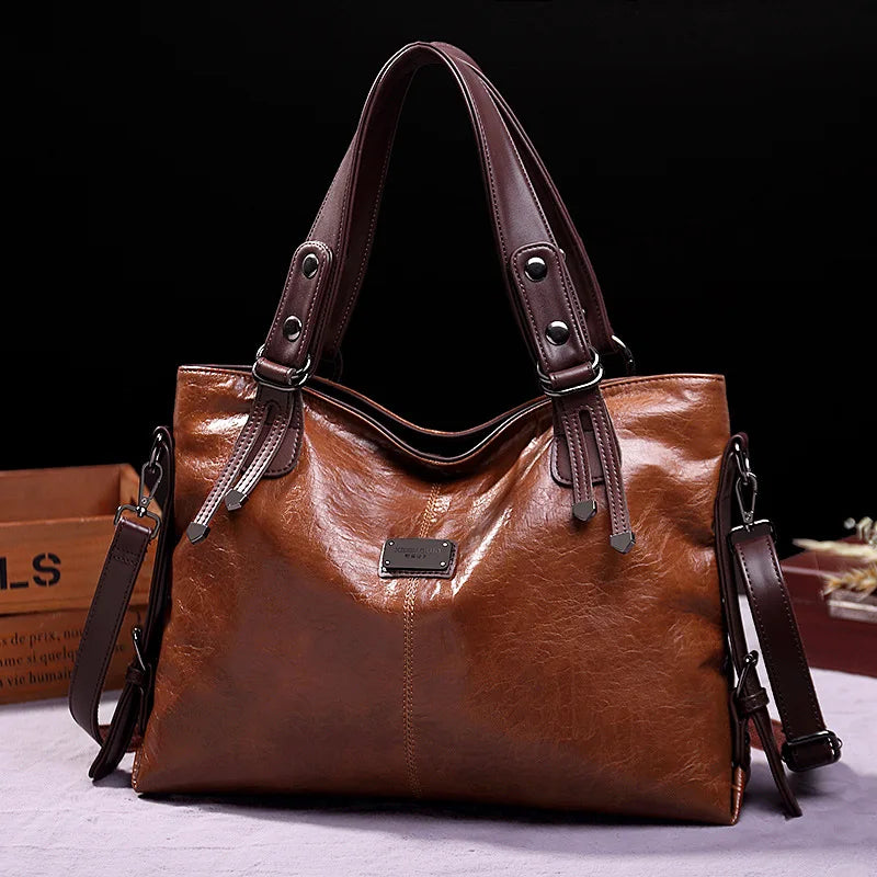 Botha™ Avery - Soft leather bag with two handles and elegant details